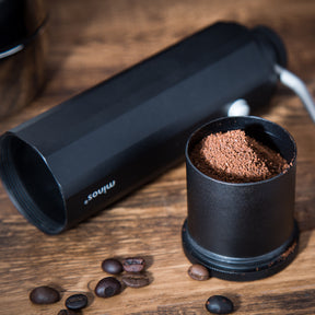 minos grinder black grounds cup filled with grounds